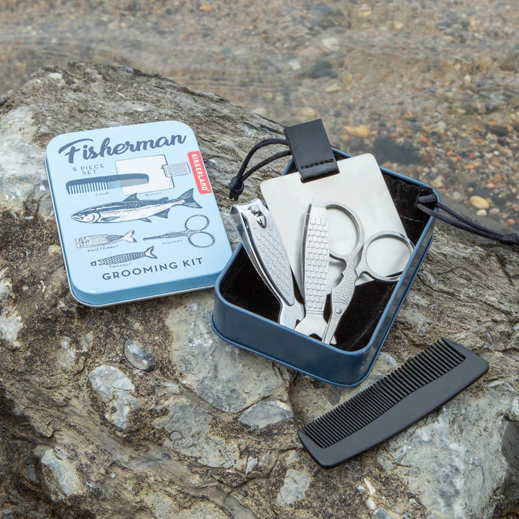 Fisherman grooming kit with tools and packaging on a stone surface