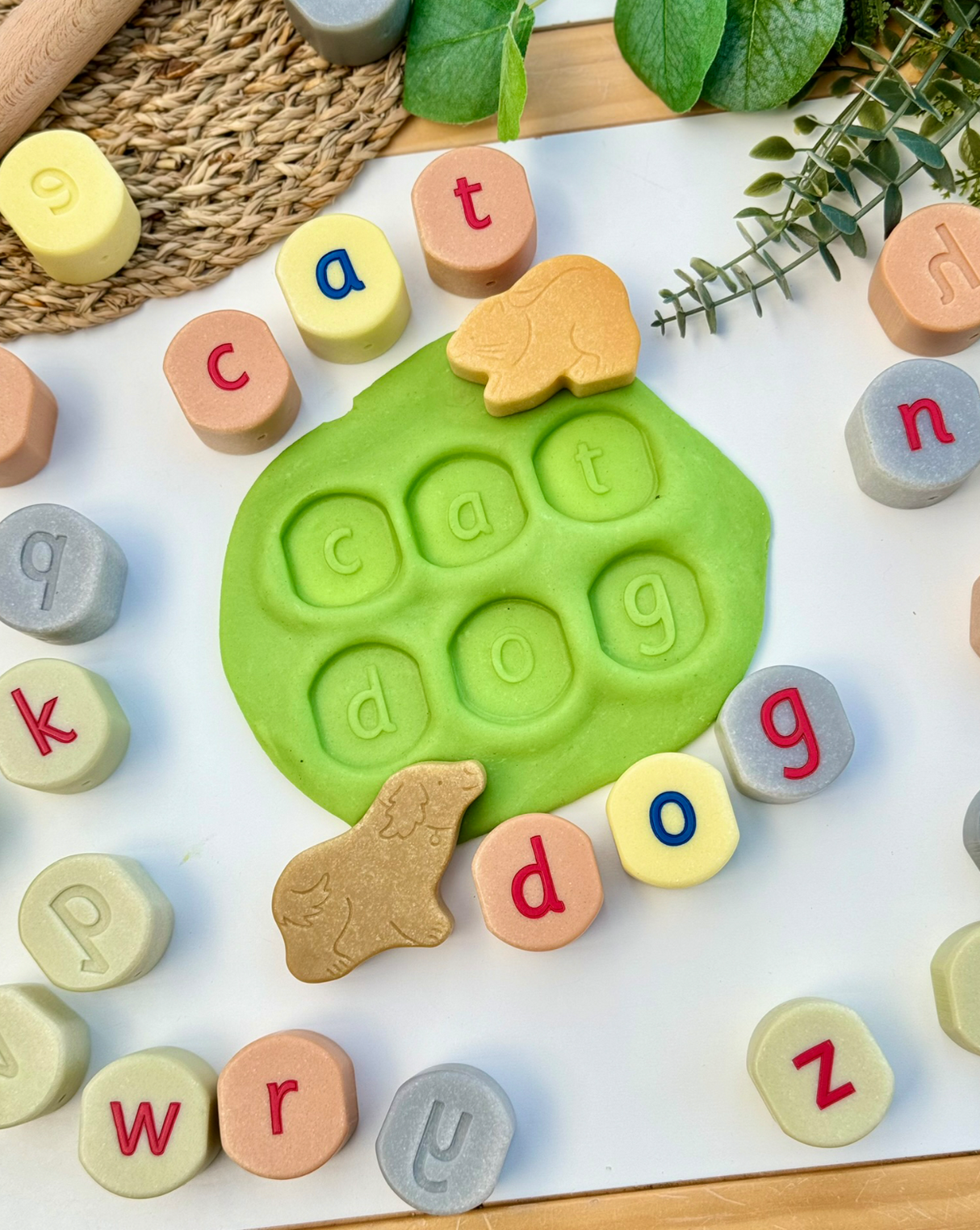 Alphabet stamping stones used to spell out a word