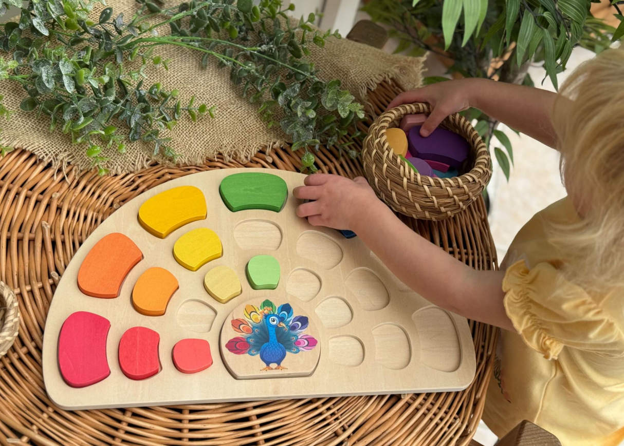 Yellow Door Pattern and Play Wooden Peacock with young girl putting in shapes