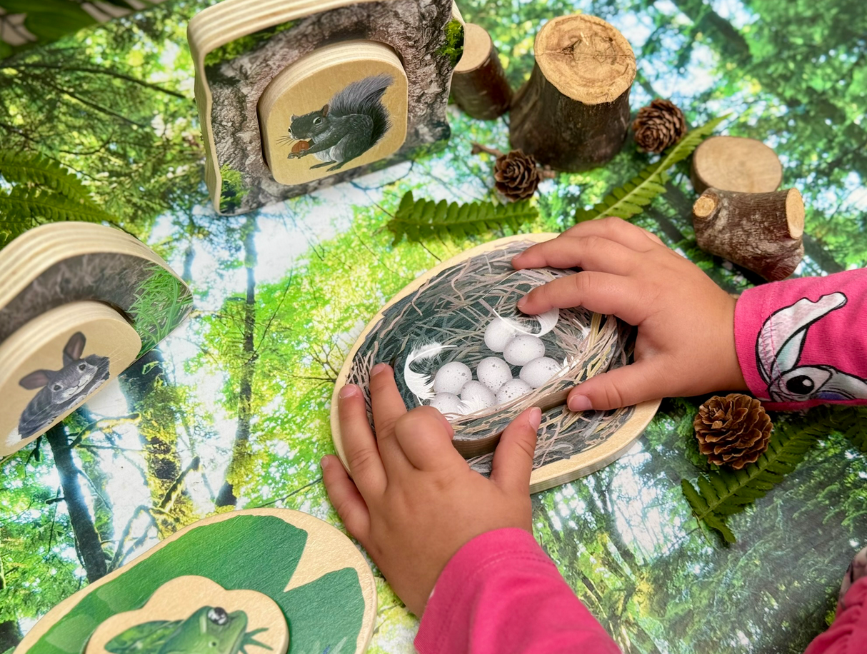 Child playing with the Yellow Door Who’s Hiding? Woodland Animals