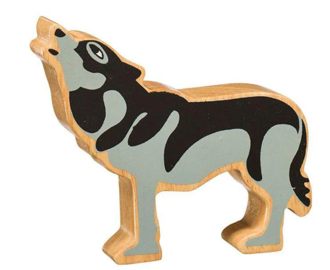 Wooden toy figure of a wolf on a white background