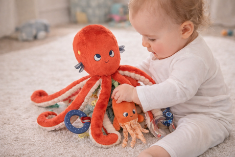 Moulin Roty Large activity octopus baby playing with it