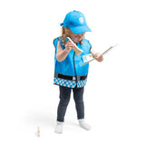 Child wearing a blue police costume with a vest, cap, and accessories on a white background
