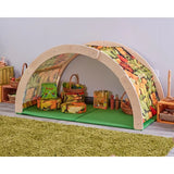 Children's playhouse with vegetable-themed fabric on a green rug
